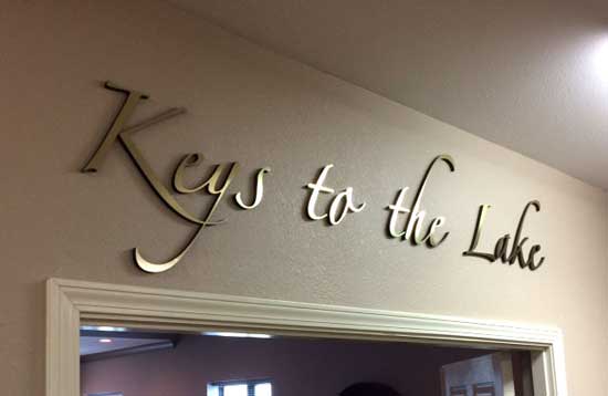 Keys to the lake resort lobby with metal face acrylic brass face letters