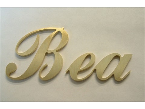 Post production shot of joined brass letters